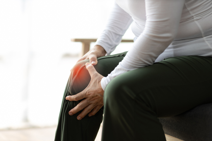 Senior woman with osteoarthritis has leg pain.