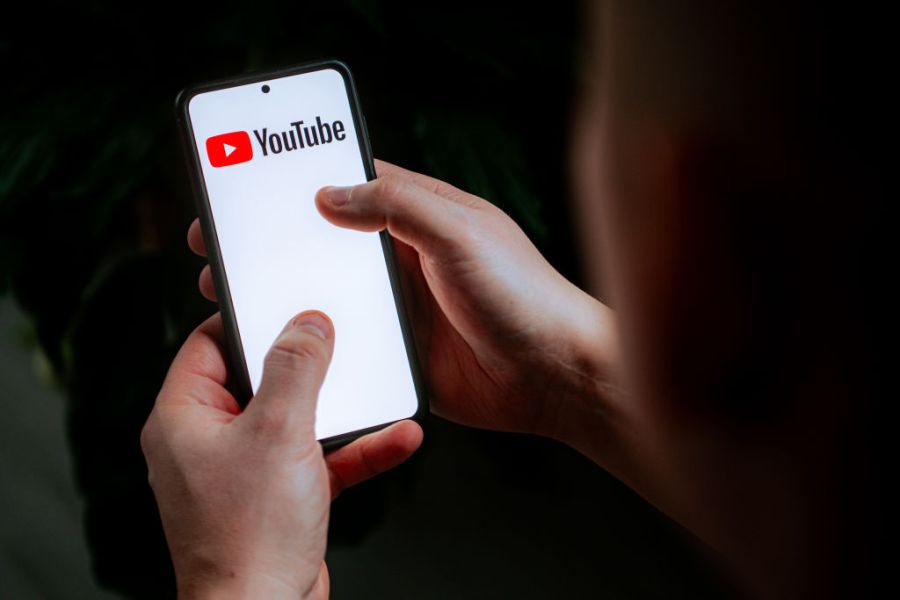 In this photo illustration a YouTube logo seen displayed on...