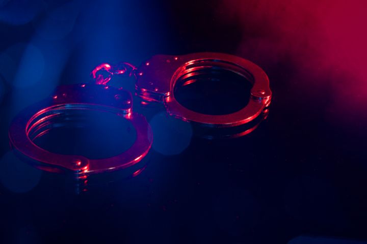 Handscuffs at Night with Red and Blue Light