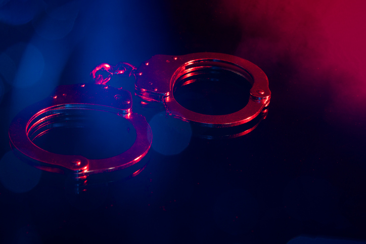Handscuffs at Night with Red and Blue Light