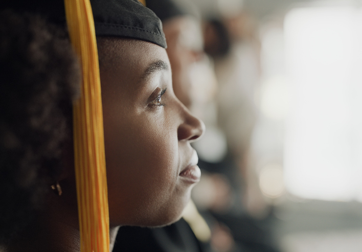 Woman, university and graduation ceremony for education achievement for college degree, scholarship or diploma. Black person, hat and campus student in America or future goal, studying or academic