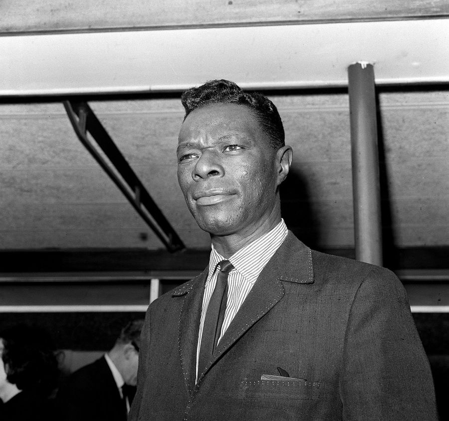 Nat King Cole arriving at London airport