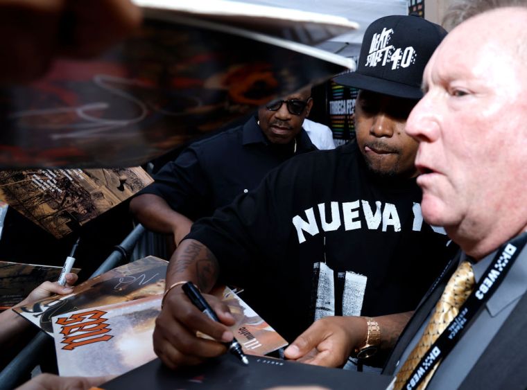 DAY 9: Nas signs a copy of his classic debut album, 'Illmatic'