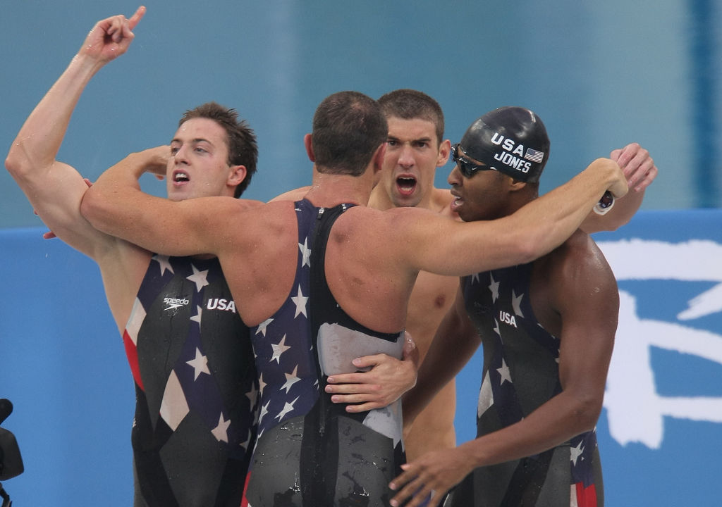 Garrett Weber-Gale, Jason Lezak, Michael Phelps and Cullen Jones celebrate their Gold medal win in the 4 x 100 relays that edged out France by .08 of a second, at the 2008 Olympic Games, Monday Aug. 11, 2008 in Beijing, China.