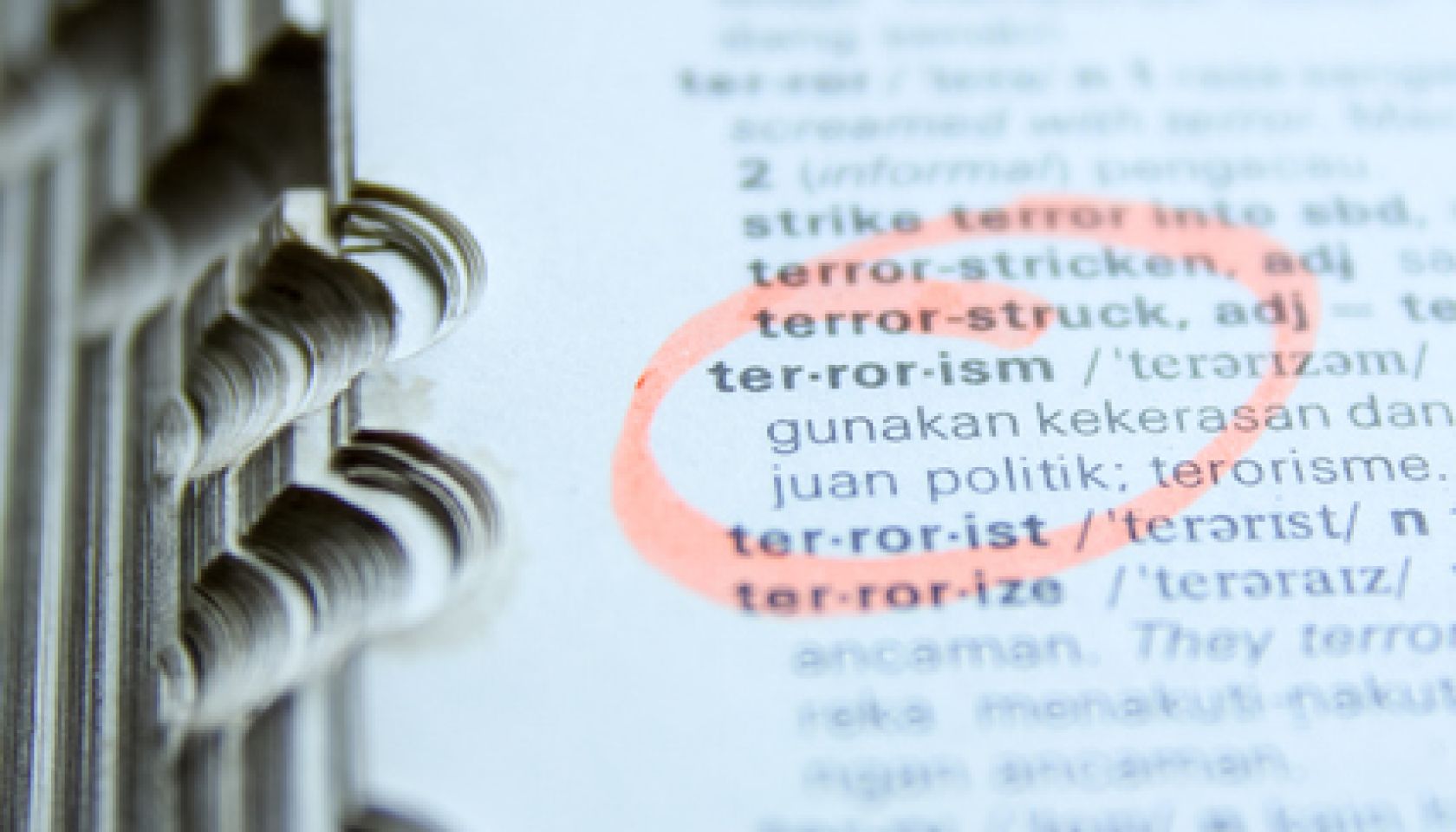 An Open Dictionary with Highlighted Word "Terrorism"