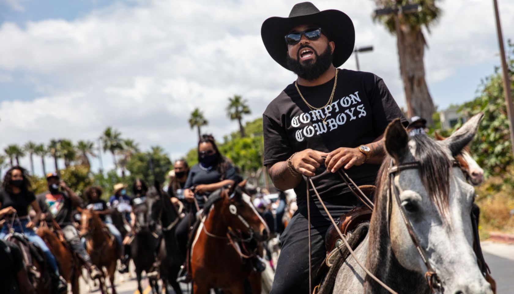The Compton Cowboys participate in a Compton Peace Walk