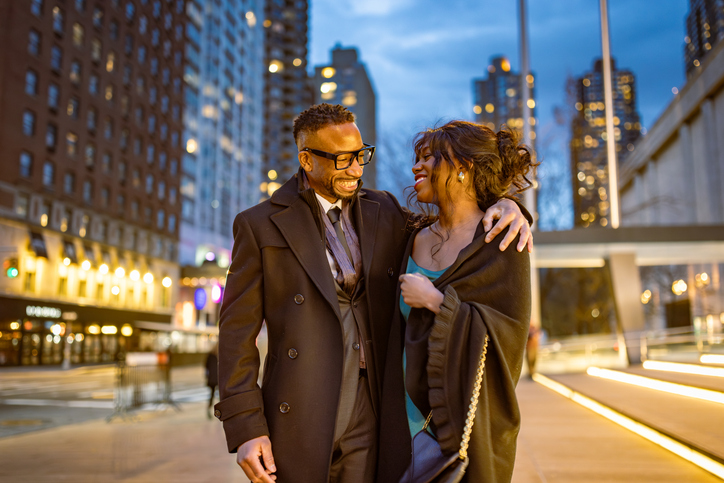 Elegantly Dressed Couple Walking in Manhattan at Dusk