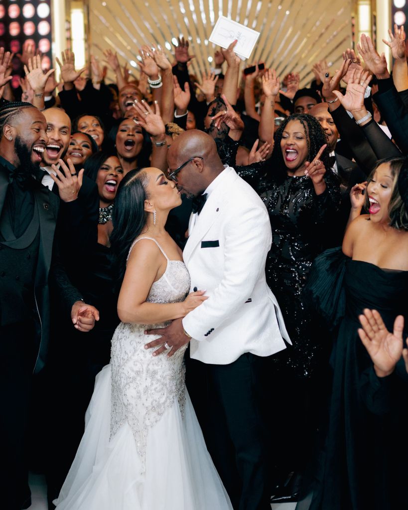 Bride and Groom Surrounded By Loved Ones