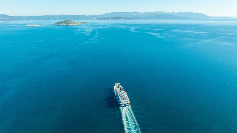 Aerial view ferry boat in blue ocean waters