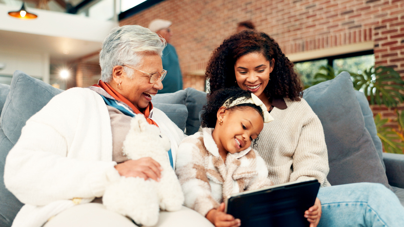 Mother, grandma and girl on sofa with tablet, happy and laugh with funny movie, care and bonding. Senior woman, child and mom with app, streaming or film subscription for generations in family home