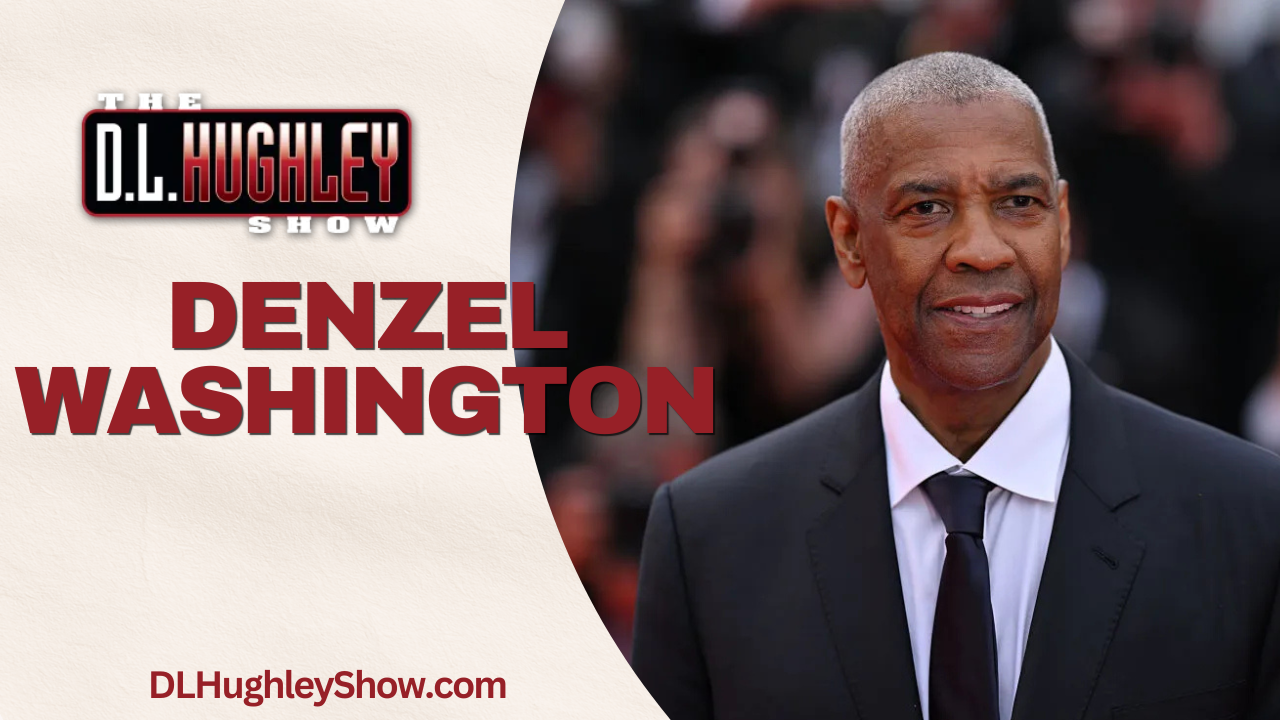 Denzel Washington, an acclaimed African American actor, posing in a suit and tie at a formal event.