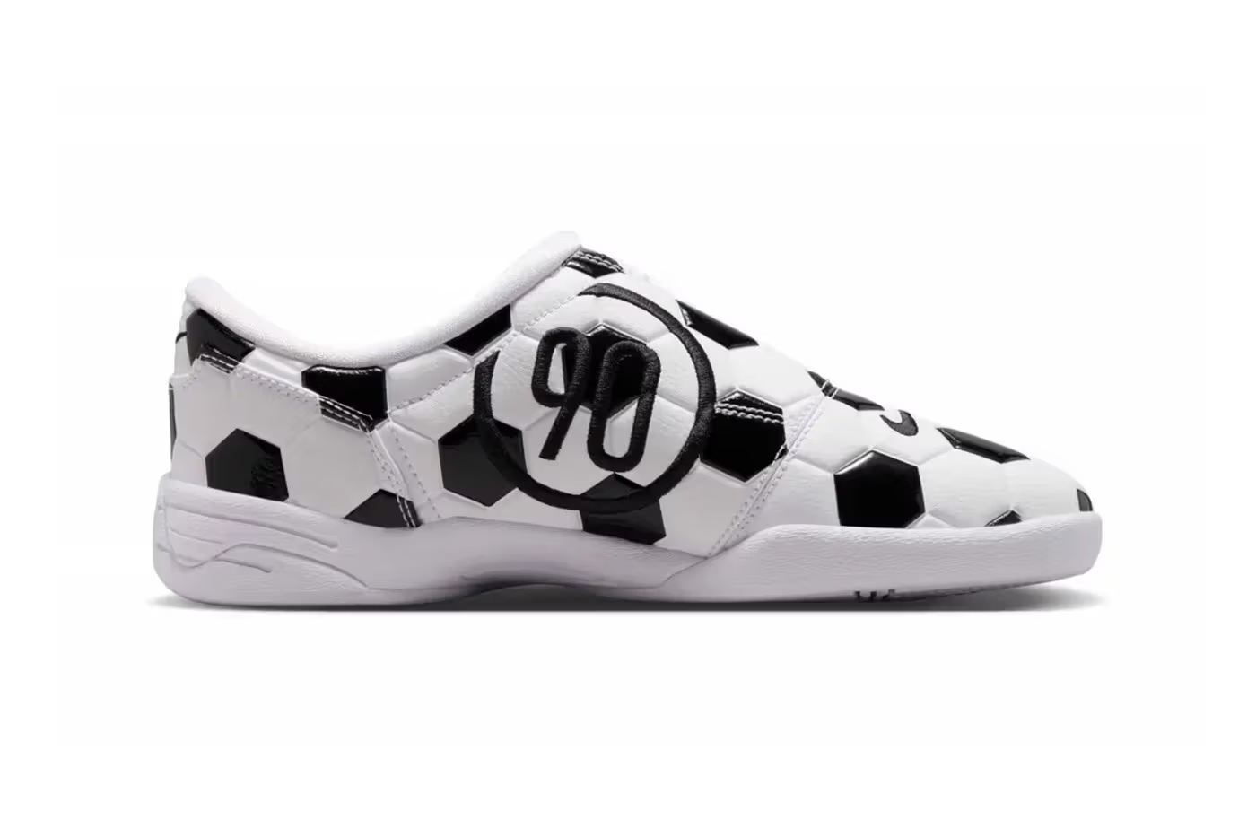 A black and white patterned sneaker with the number 99 printed on it.