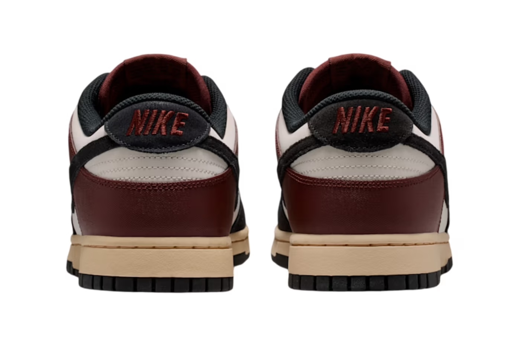 A pair of Nike sneakers in burgundy, black, and beige colors with the Nike logo prominently displayed.