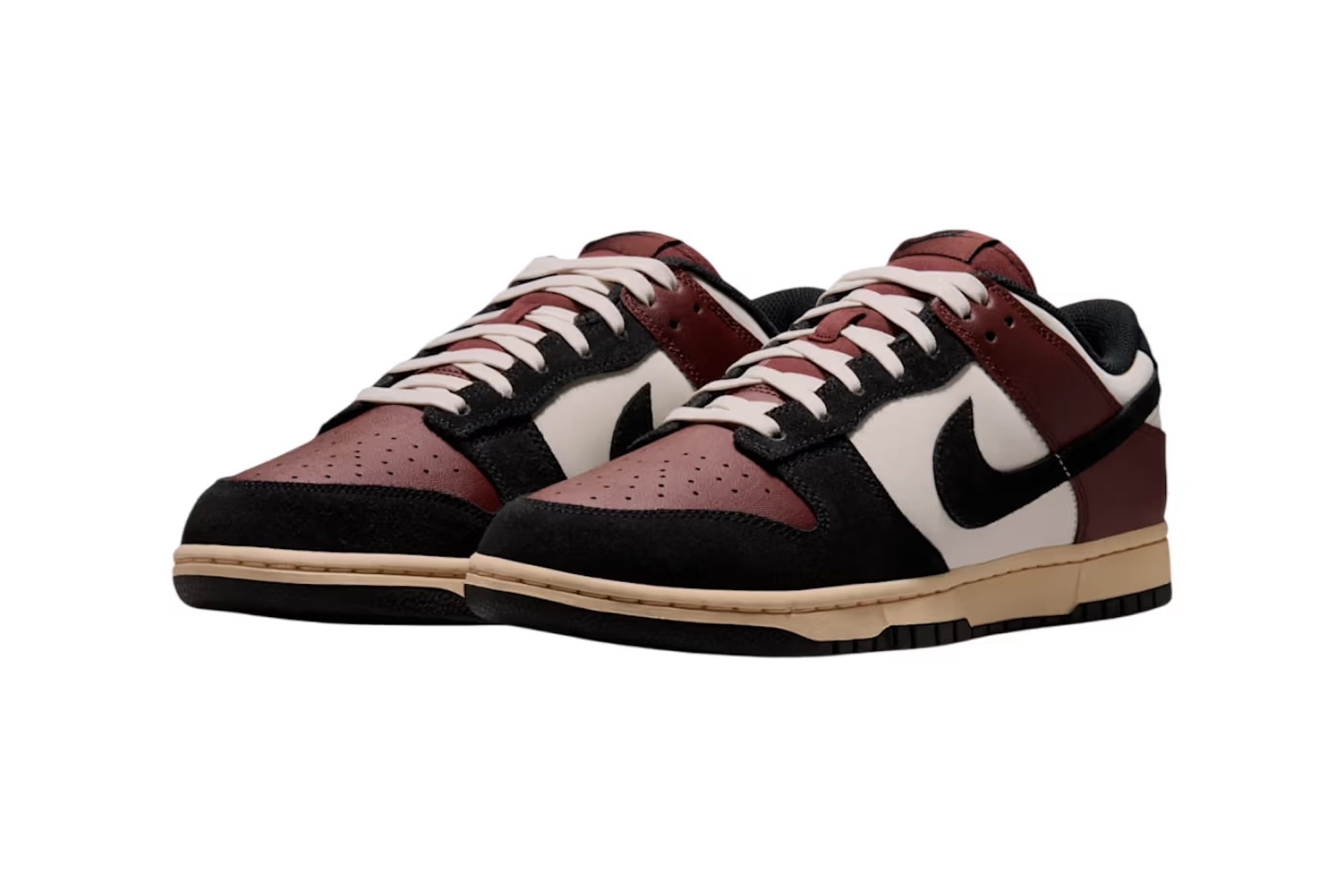 A pair of burgundy and black Nike Dunk Low sneakers with white laces and soles.