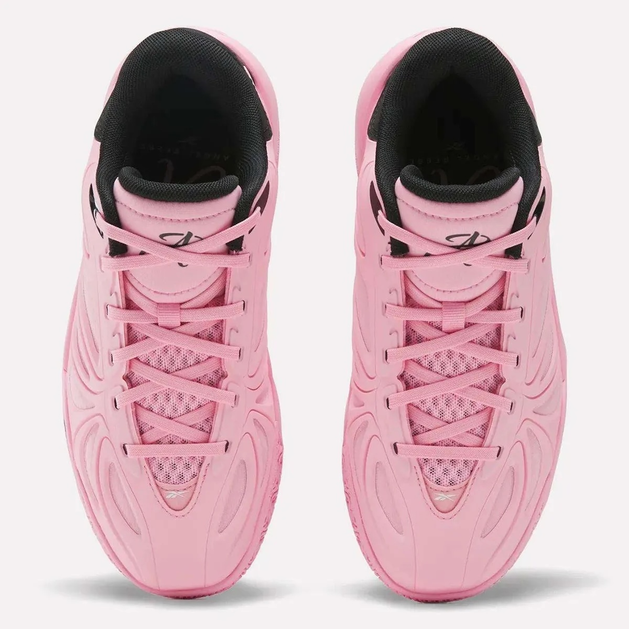 A pair of pink and black athletic shoes with laces and a textured sole.