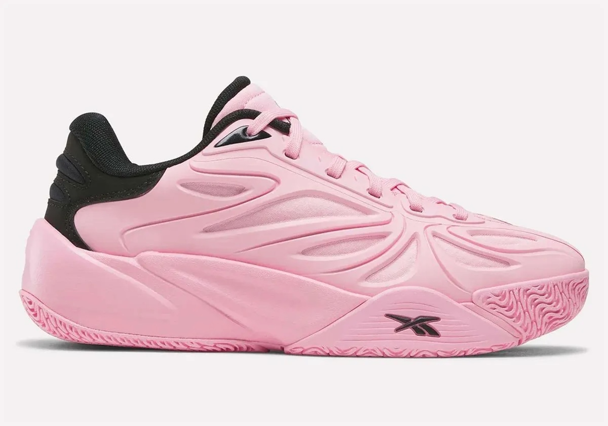 A pair of bright pink sneakers with black accents and a distinctive sole design.