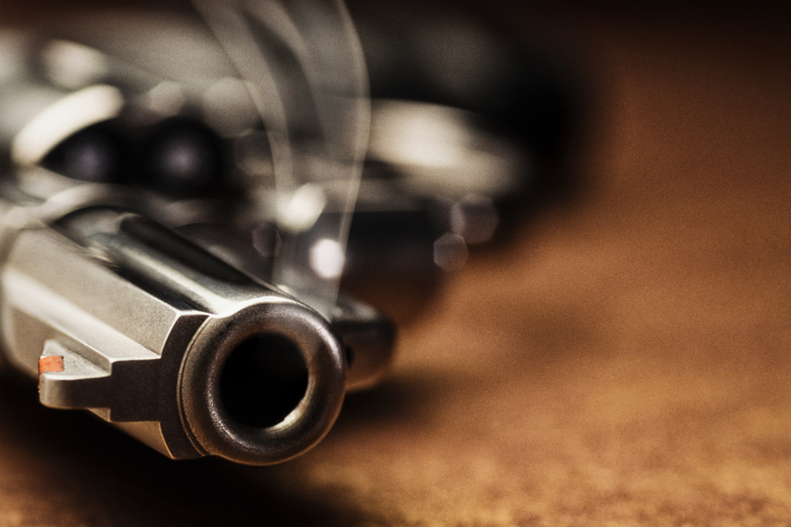 Smoking gun lying down on the floor