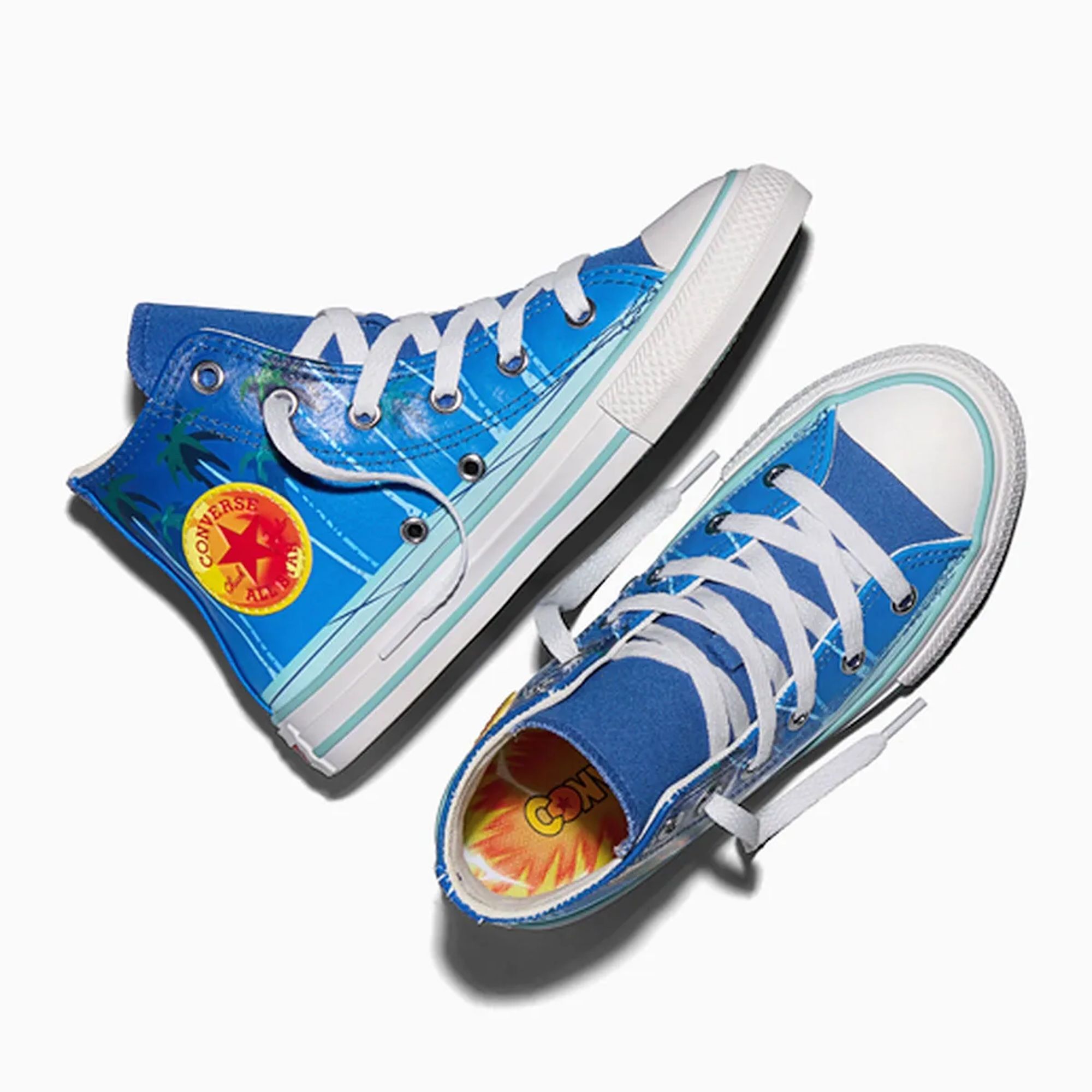 Blue and white Converse All Star sneakers with a Converse logo on the side.