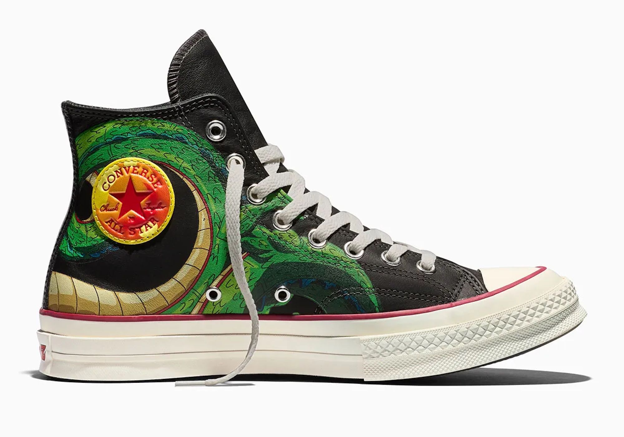 A black and green Converse All Star sneaker with a colorful, abstract design featuring a Converse logo.