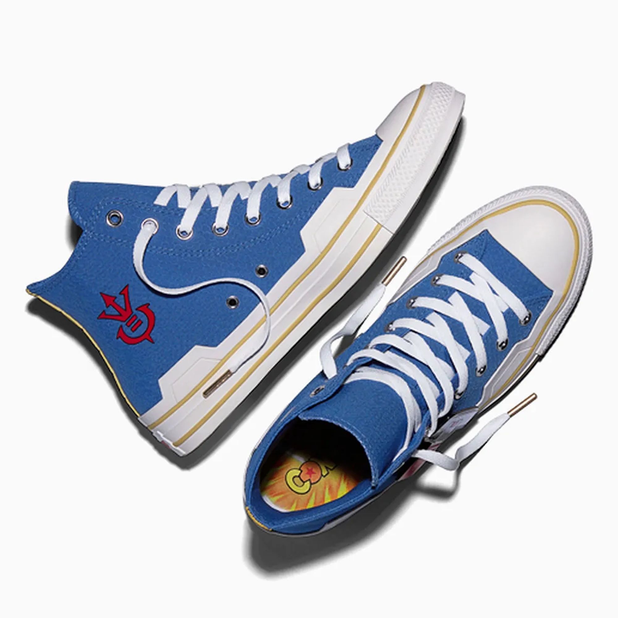 Blue and white high-top sneakers with red logo and yellow accents.
