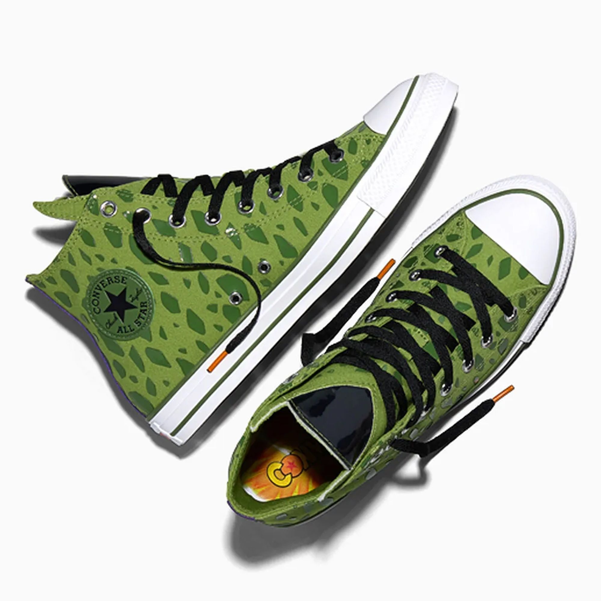 Green camouflage-patterned Converse All Star sneakers with black laces and white soles.