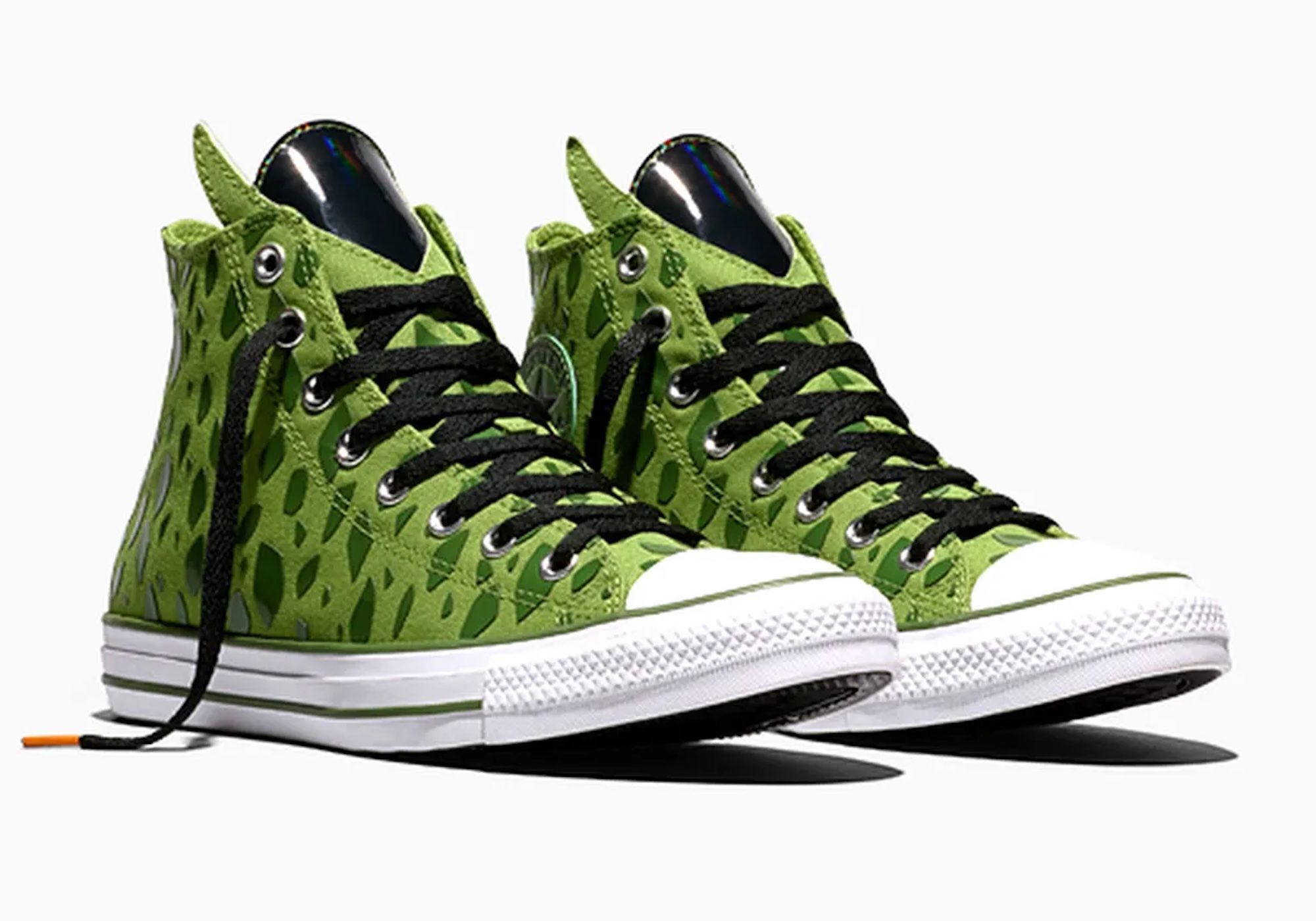 A pair of green and black high-top sneakers with a camouflage-like pattern.