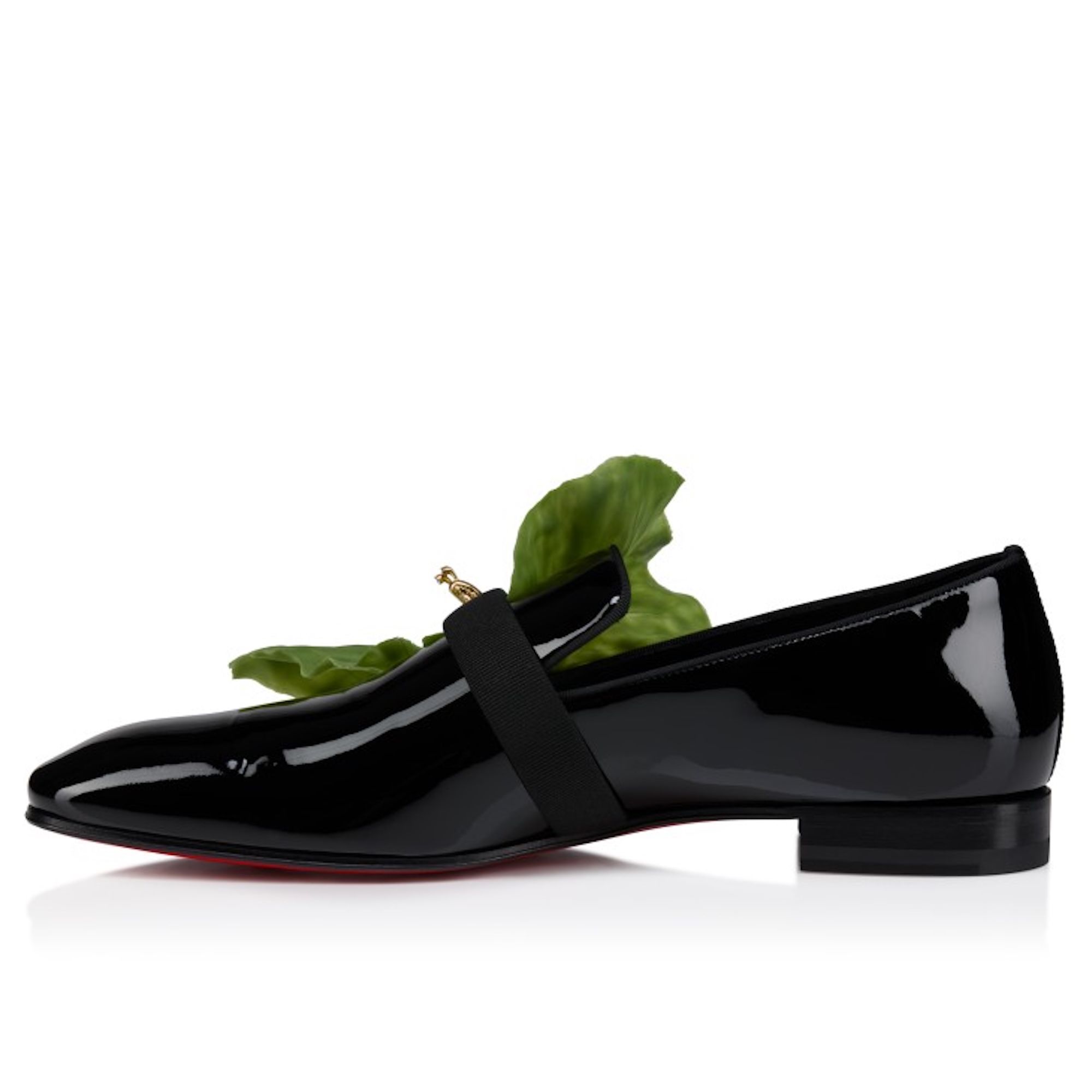 Black patent leather loafer with green leaf accent
