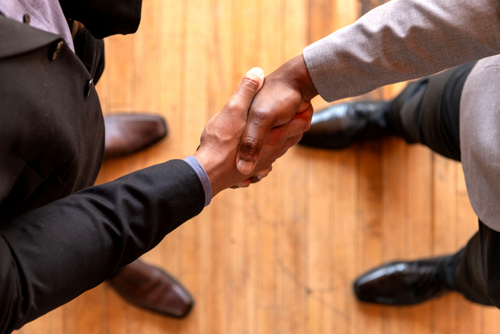 Business handshake sealing deal