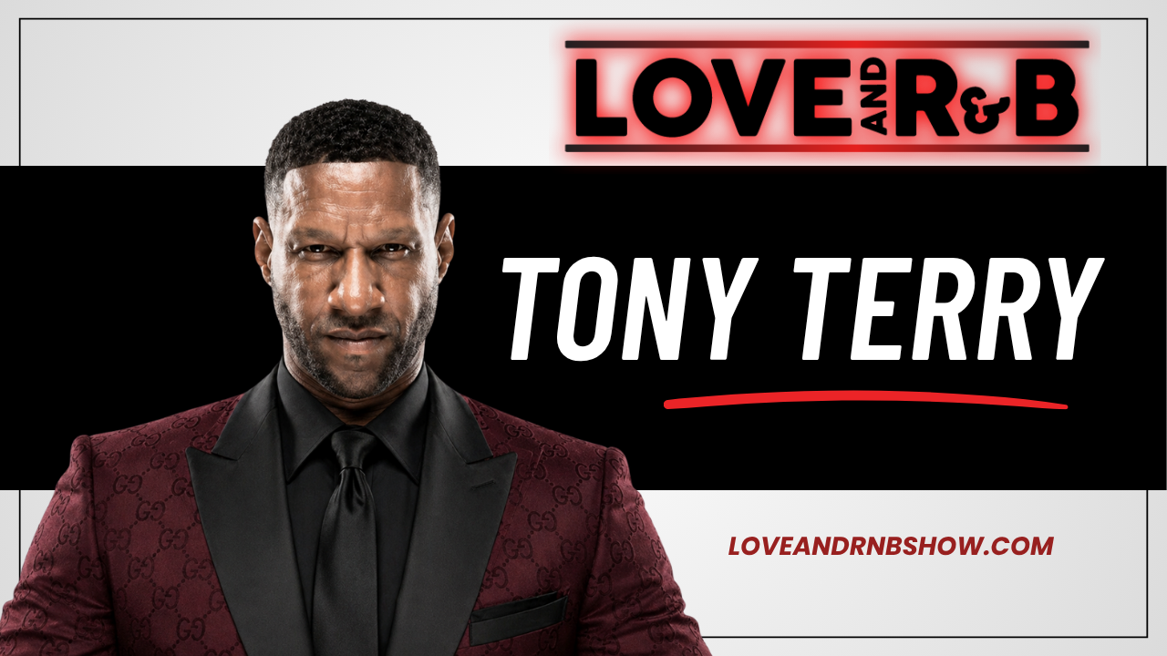 A well-dressed Black man in a burgundy suit and tie, standing in front of a backdrop with the text "LOVE and R&B" and "TONY TERRY".