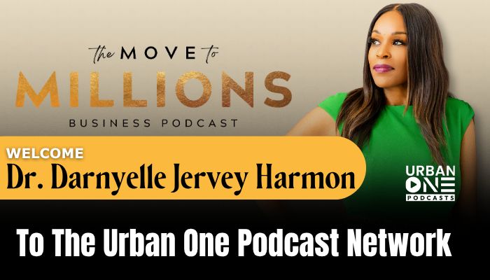 A woman in a green top standing in front of a backdrop with the text "The Move to Millions Business Podcast" and "Welcome Dr. Darnyelle Jervey Harmon to The Urban One Podcast Network".